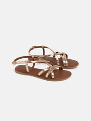 Flat sandal in genuine leather with crossed straps - GOLD